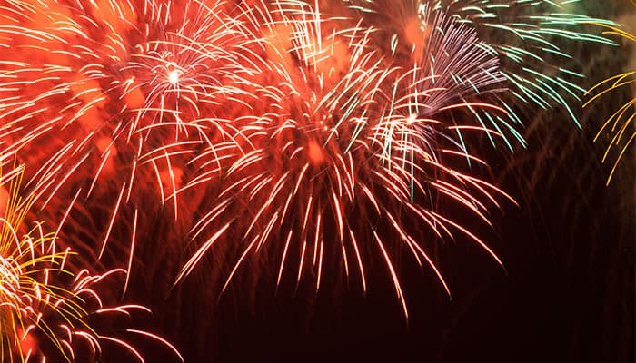 Red fireworks in the night sky