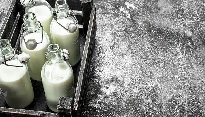 Glass bottles filled with milk