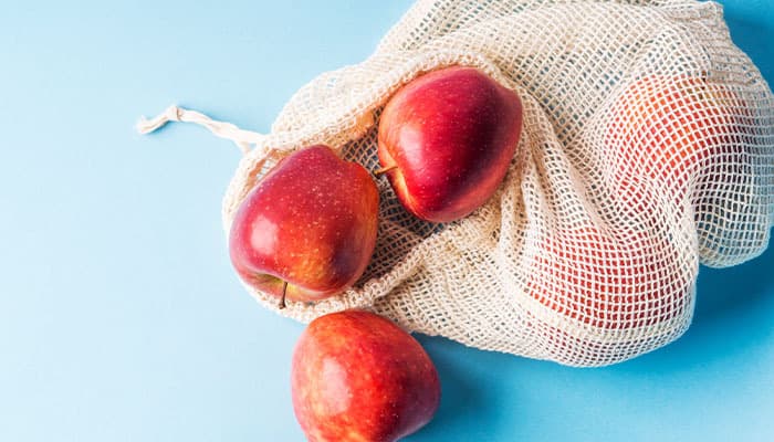 Reusable mesh bag with apples inside